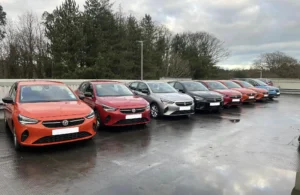 A row of cars in a car park.